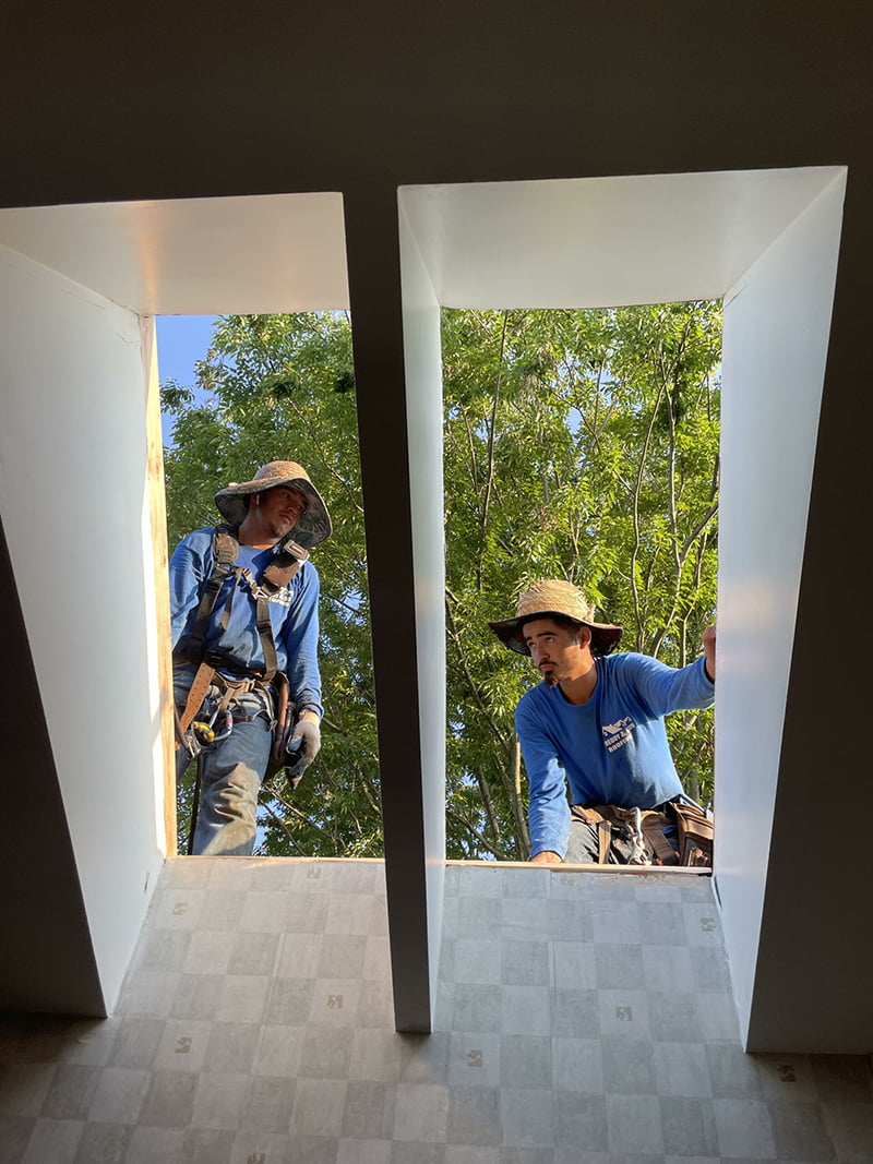 Workers installing skylights