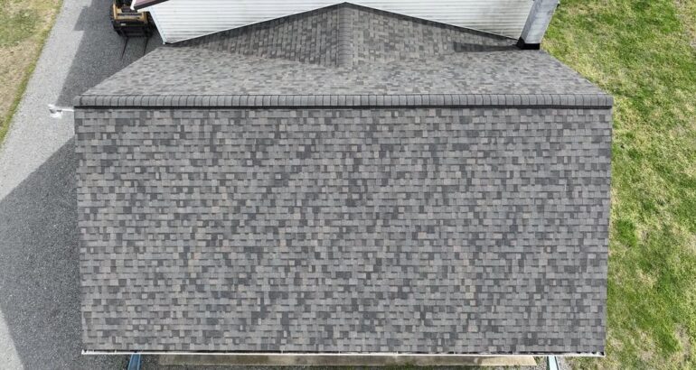 Close-up of gray asphalt shingles on a residential roof