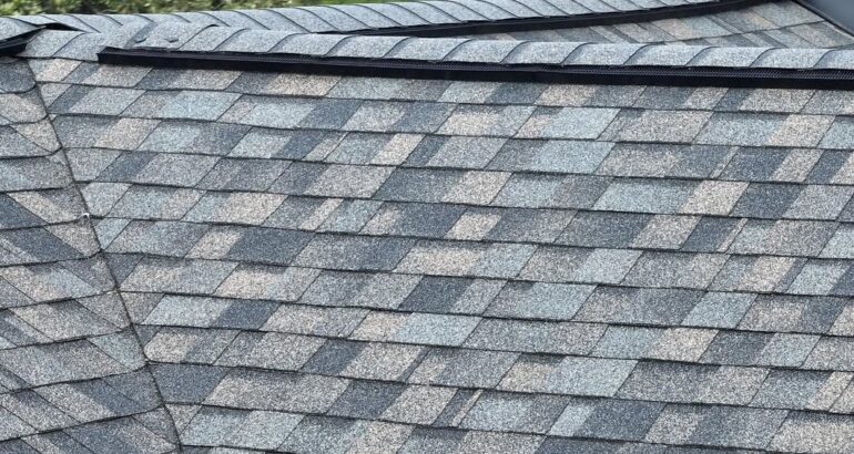 Close-up of residential asphalt shingles after roof replacement