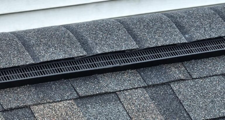 Roof ridge and ventilation detail on a residential shingle roof
