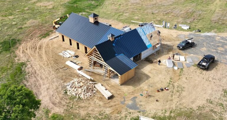 Completed commercial metal roofing project on a large building