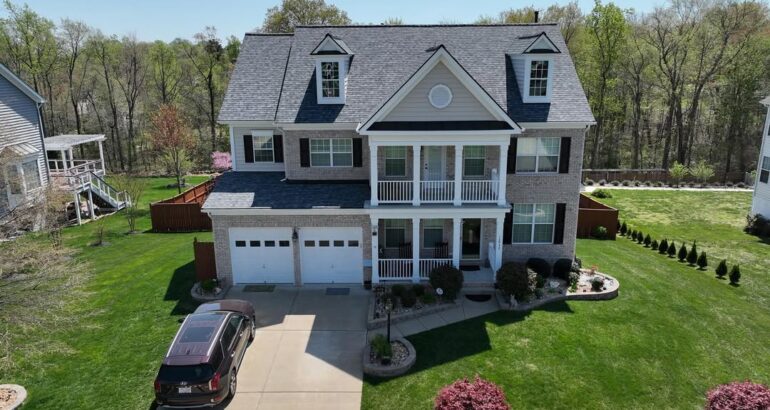Finished residential roof replacement on a two-story home
