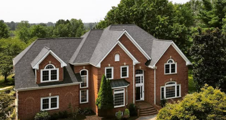 Residential roofing in Great Falls VA on a large brick home with gray shingles