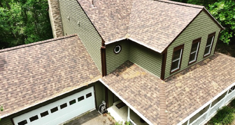 Residential roofing in Middleburg VA on a home with tan shingles and wooded surroundings